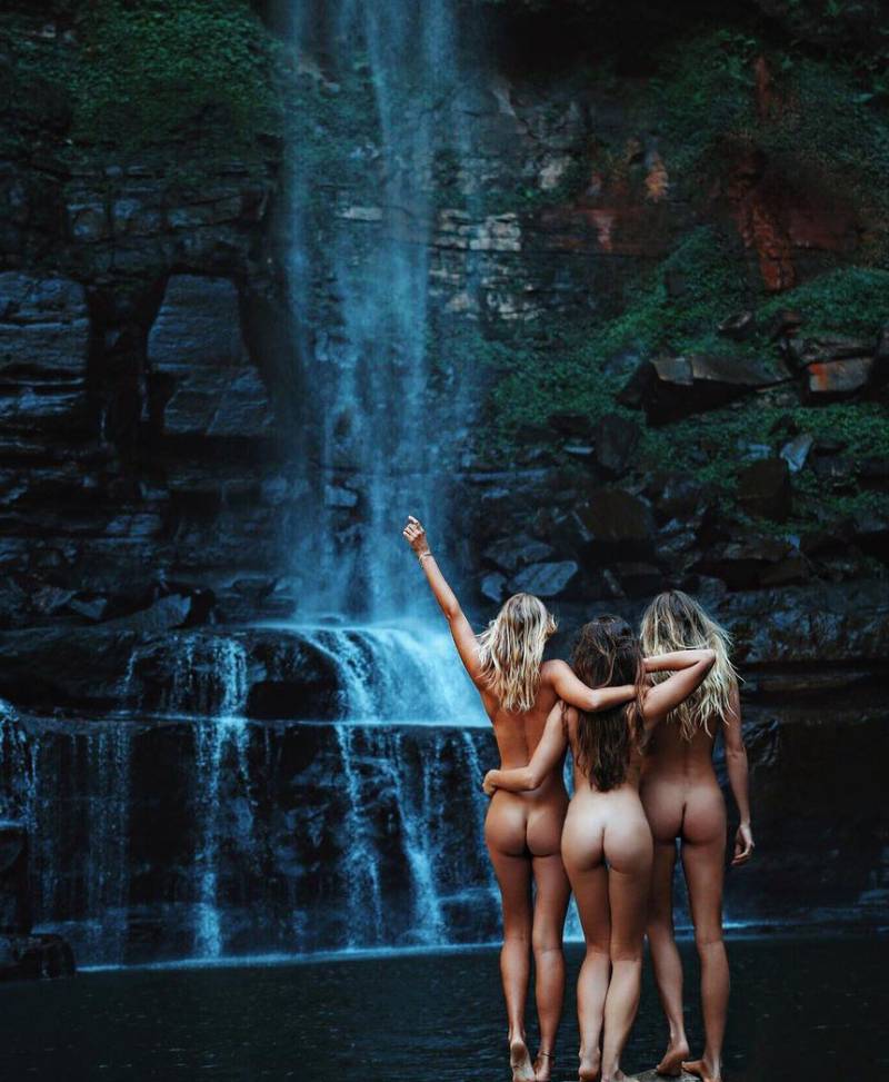Naked beauties at the waterfall